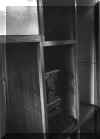 Thumbnail image of the inside of the more stylish but unknown caravan type. The coal-burning stove is pictured. Click here for a larger image that will open a new window. 