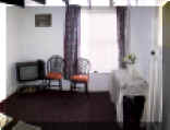 Thumbnail image of Pentre Cottage lounge/diner. Click here for a larger image.